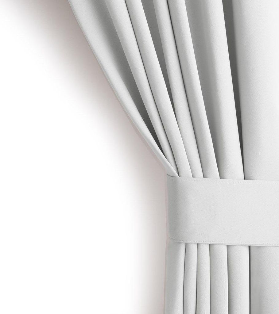 A close-up view of a white curtain, neatly folded and held by a fabric band.