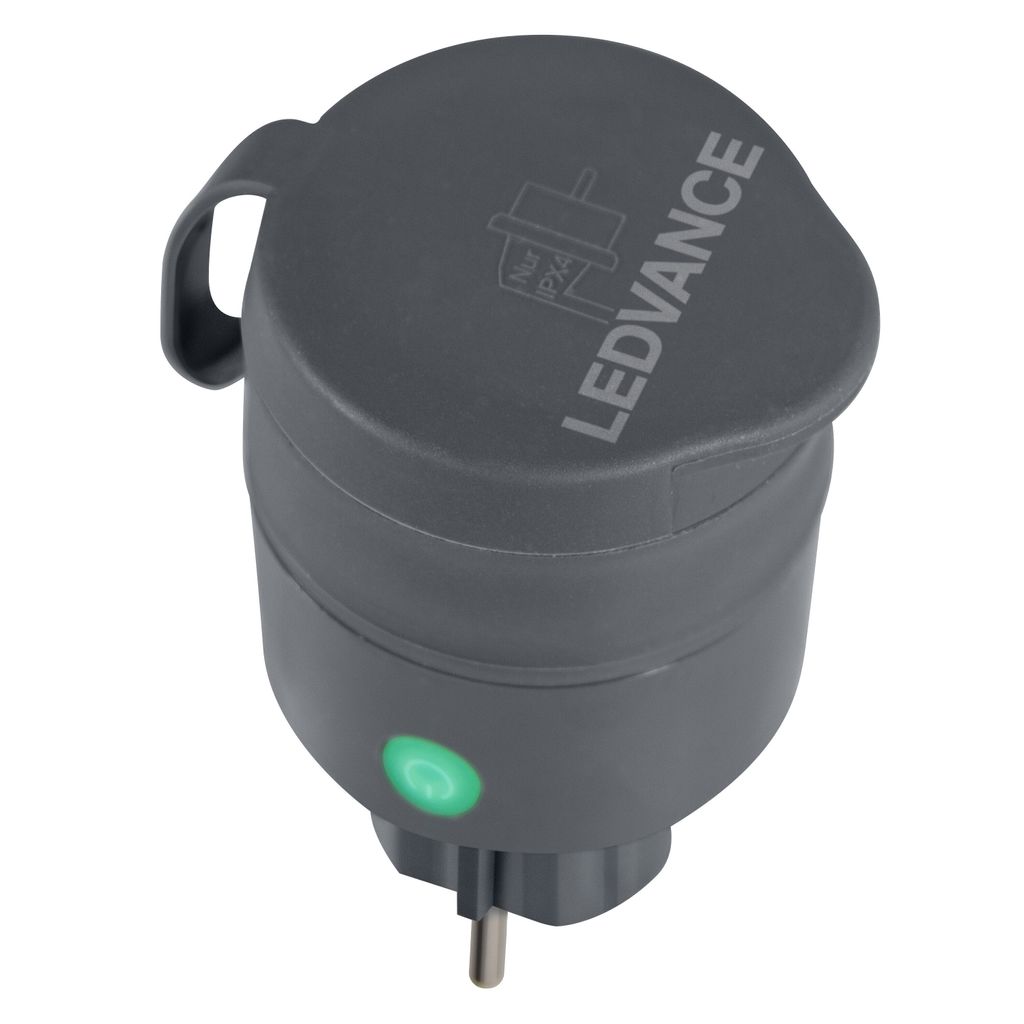A gray smart plug with a green indicator light.