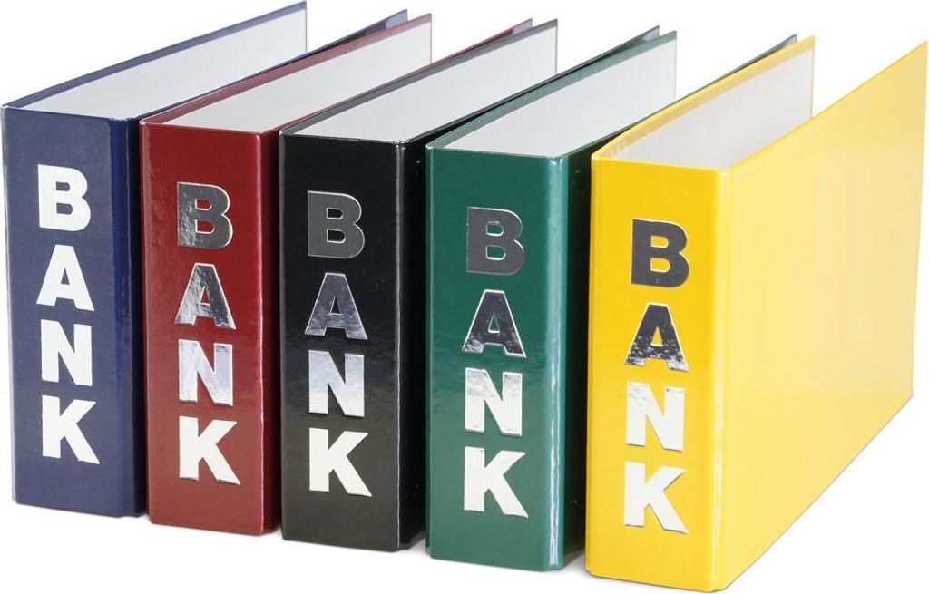 Five binders in different colors arranged diagonally on a white background.