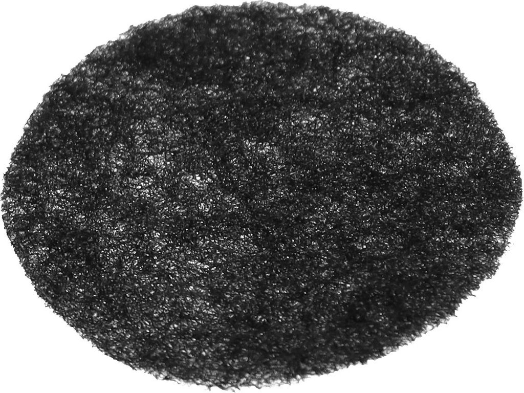 A close-up, top-down view of a black, porous, circular pad.