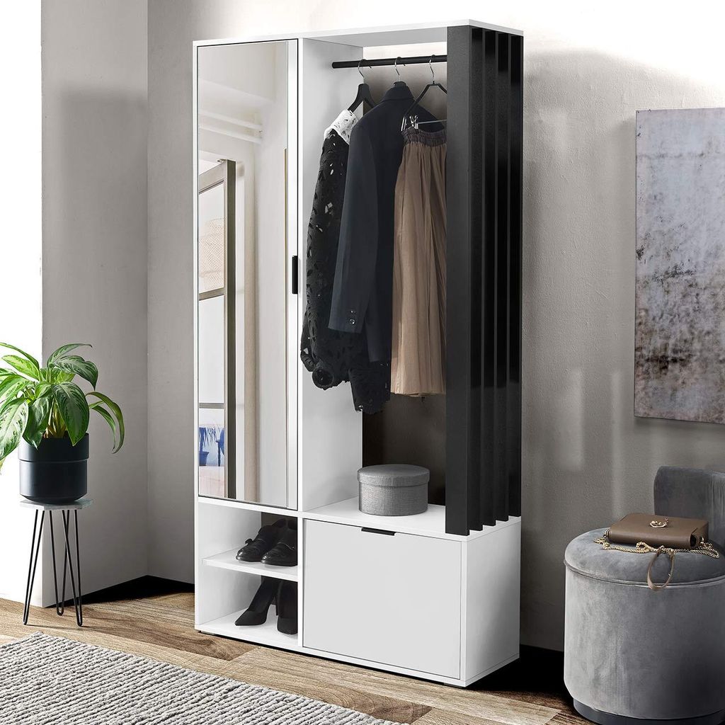 A modern hallway wardrobe set with a mirror, clothes hanging, and storage compartments, set against a neutral wall.