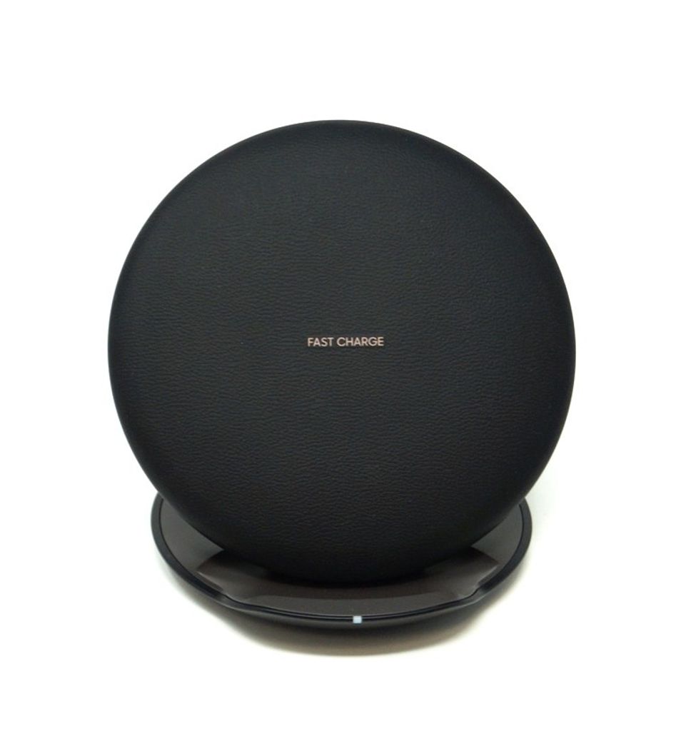 A black wireless charging pad is shown against a white background.