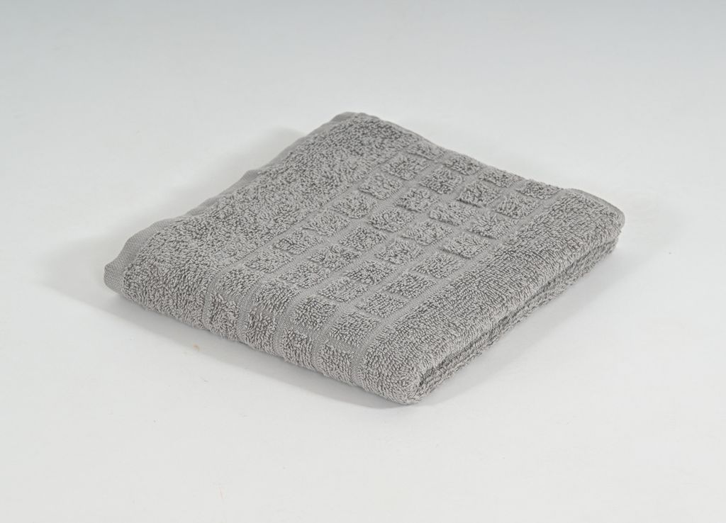 A folded gray towel is shown on a white background.