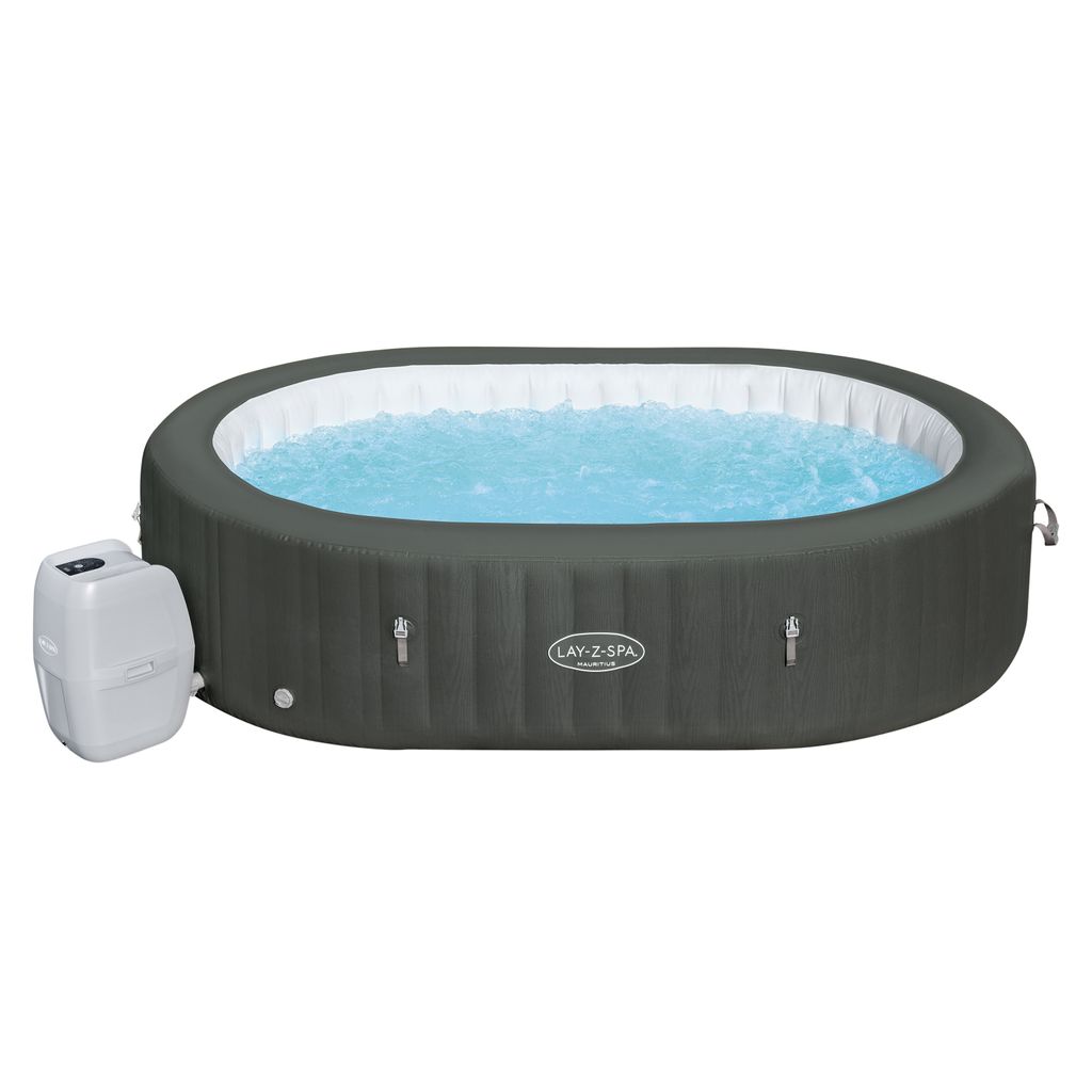 An inflatable hot tub filled with blue water, with a pump unit attached to the side.