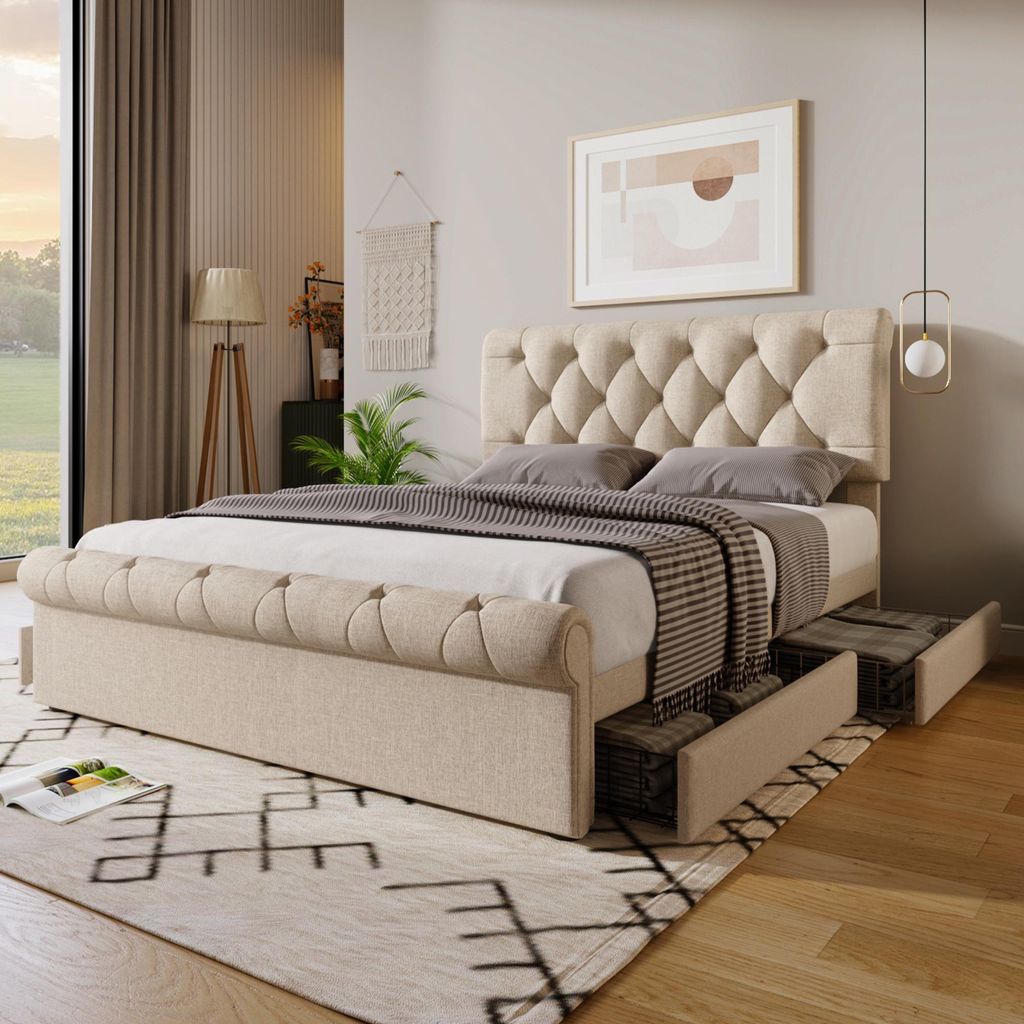 A bedroom scene featuring a tufted bed with storage drawers, a rug, and a window with curtains.