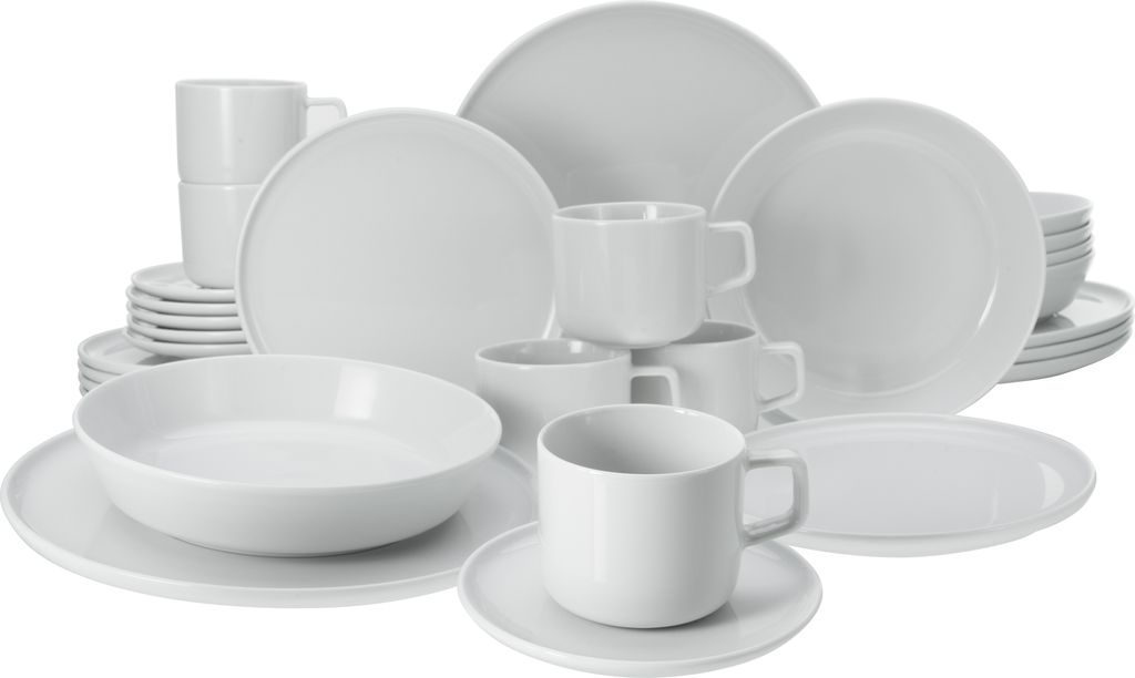 A collection of white ceramic dishes and cups arranged on a white background.