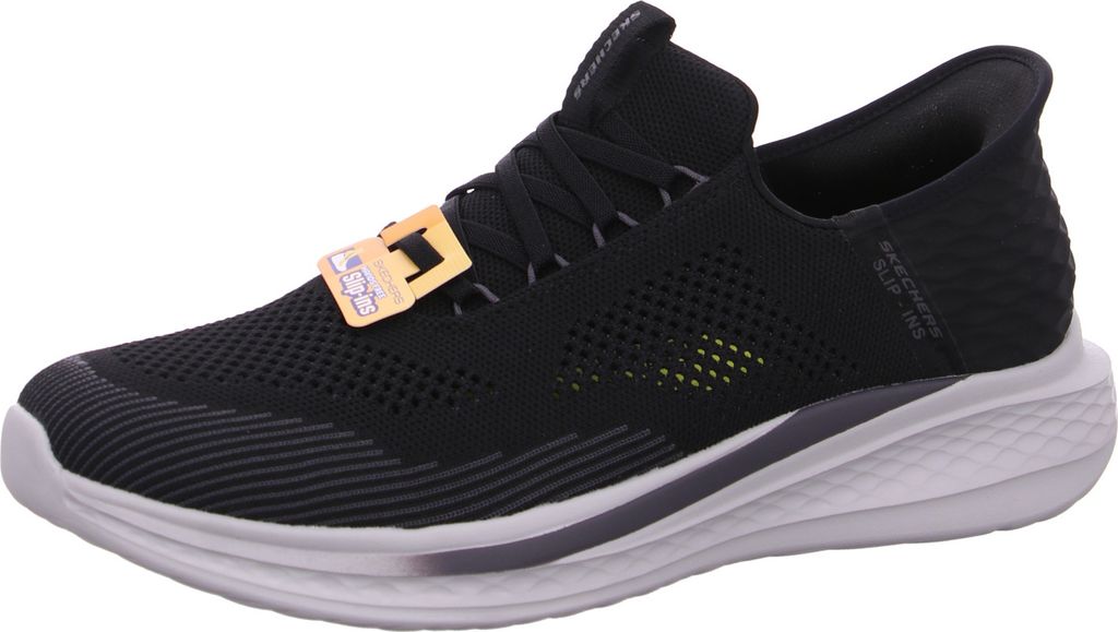 A black Skechers shoe is shown from the side against a white background.