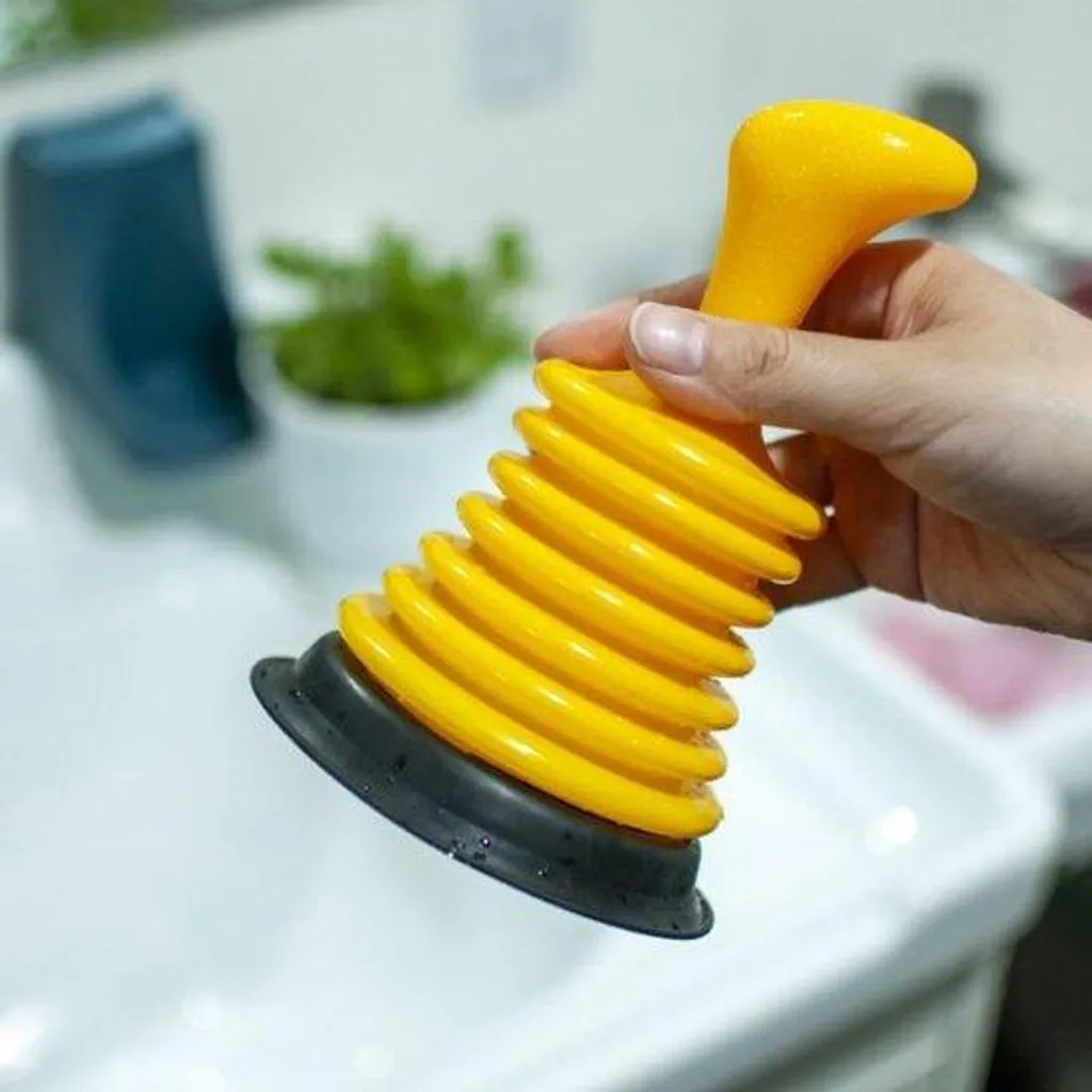 Déboucheur ventouse jaune pour éliminer les bouchons d'évier et de WC