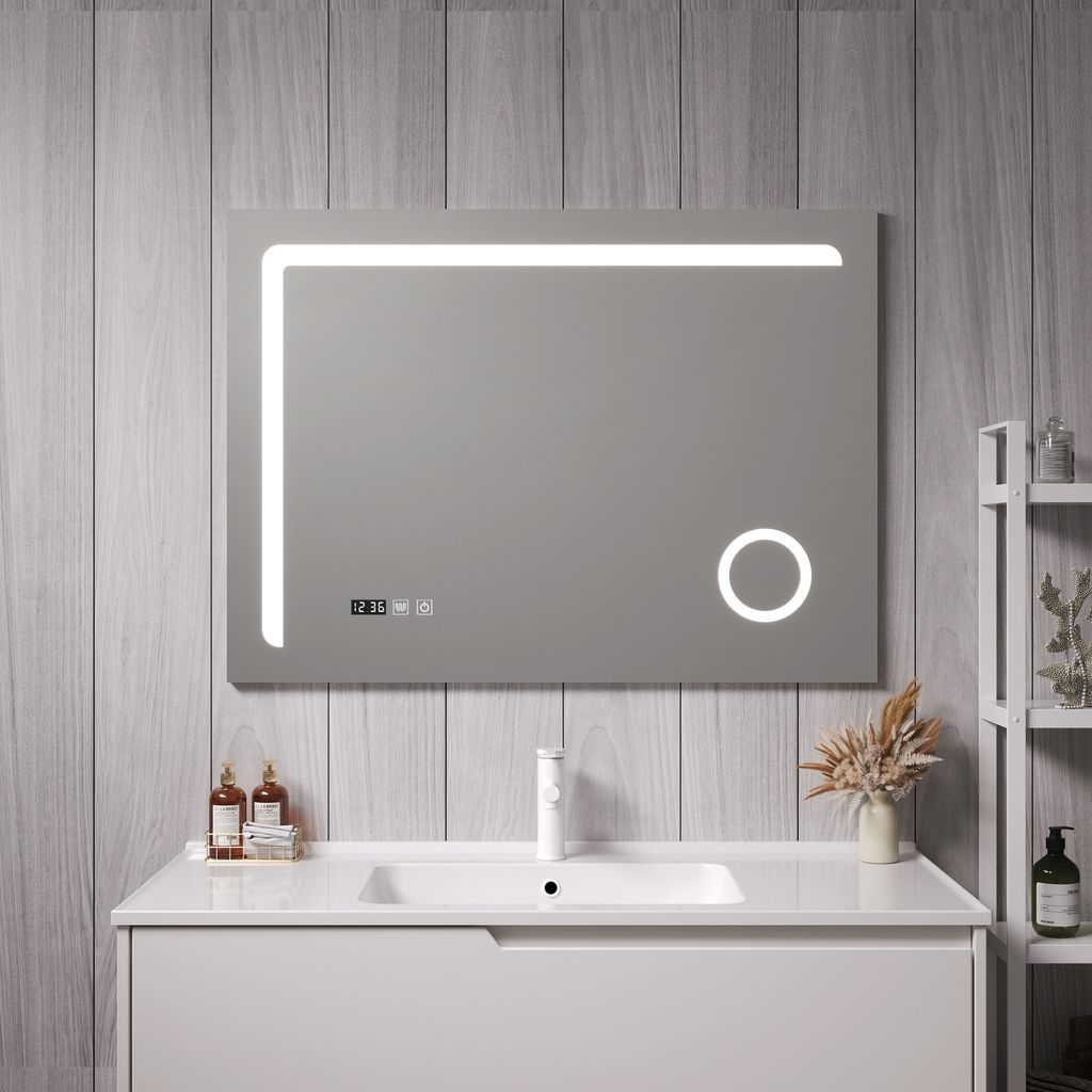A modern bathroom vanity with a sink and a large LED mirror.