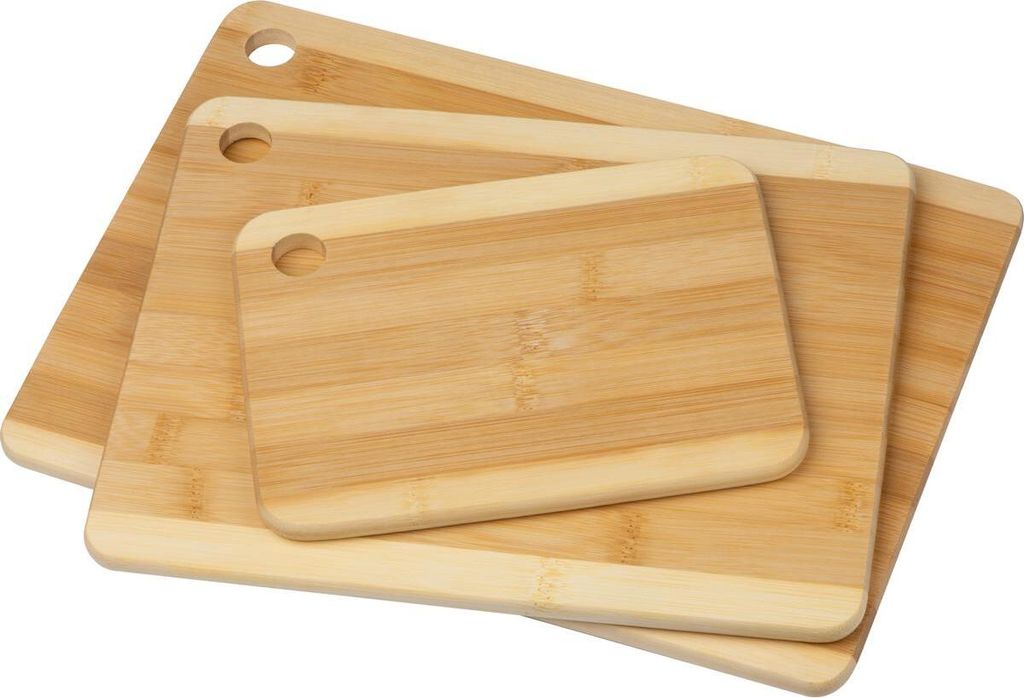 Three bamboo cutting boards of different sizes are stacked on a white background.