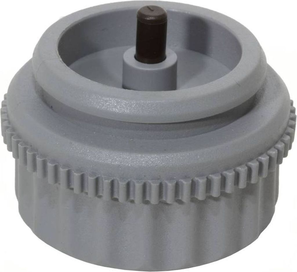 A close-up studio shot of a gray plastic valve fitting with a black central pin.