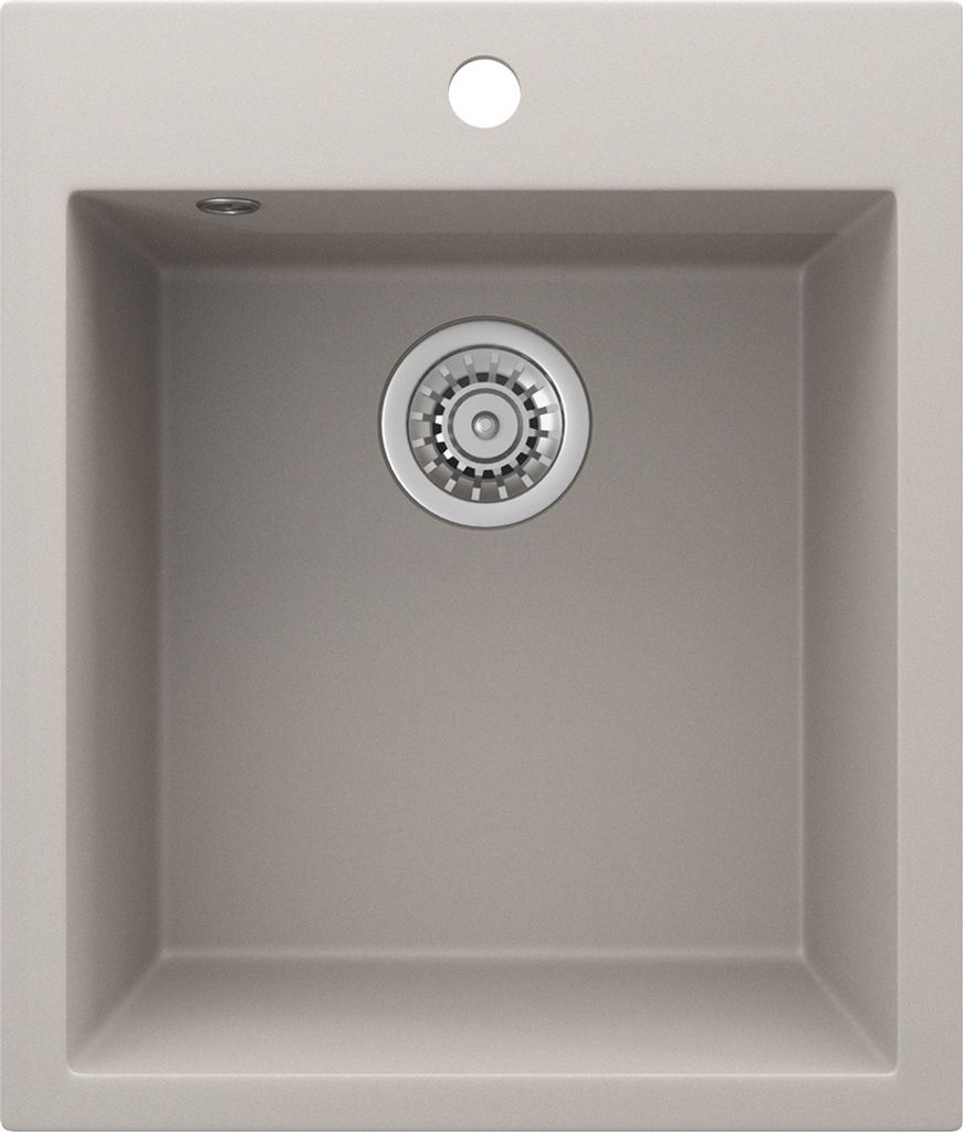 A top-down view of a beige sink with a silver drain.