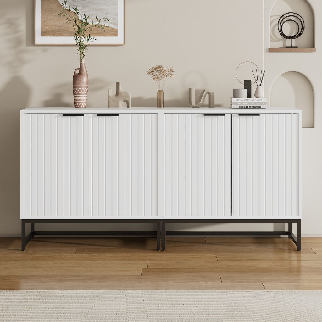 A white sideboard with fluted doors and black legs.