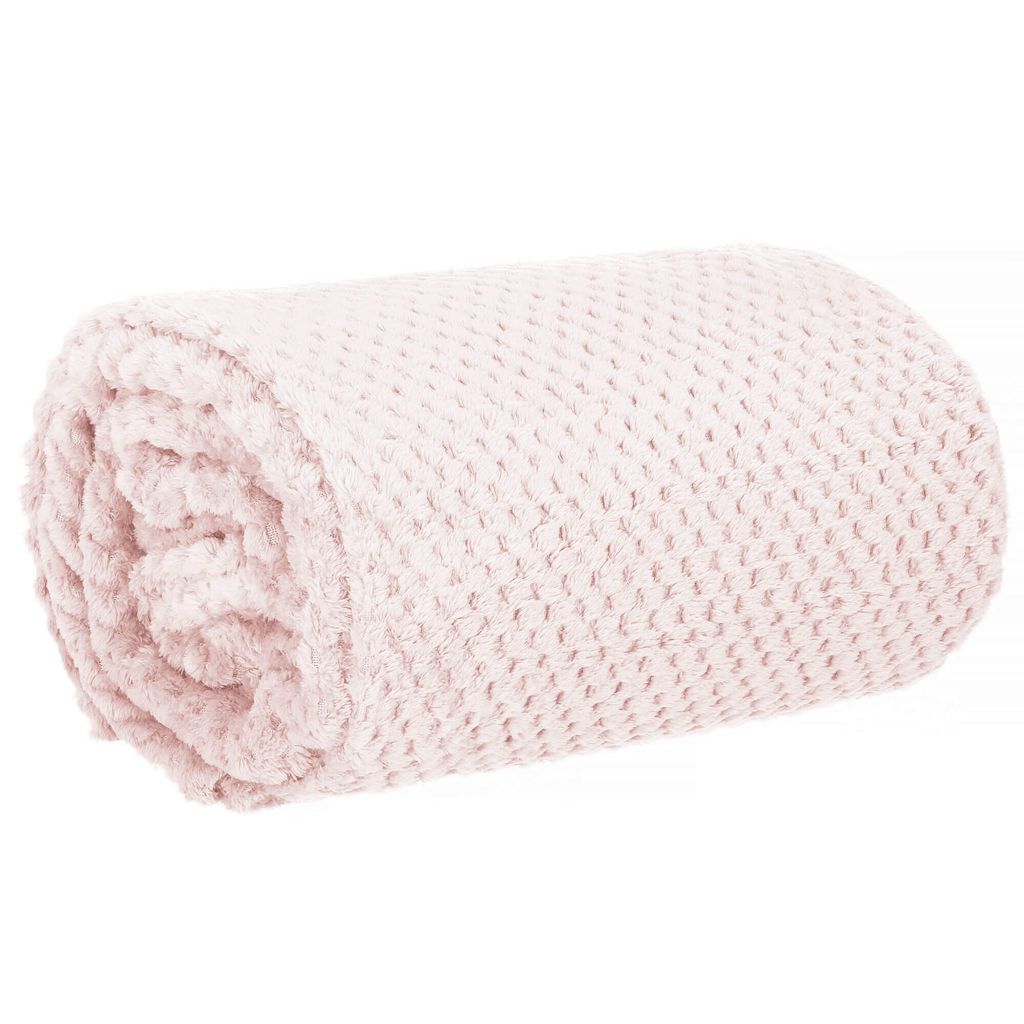 A rolled-up pink blanket with a textured pattern.