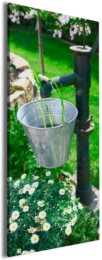 Wallario Premium Leinwandbild Wasserquelle im Garten in Größe 30 x 75 cm