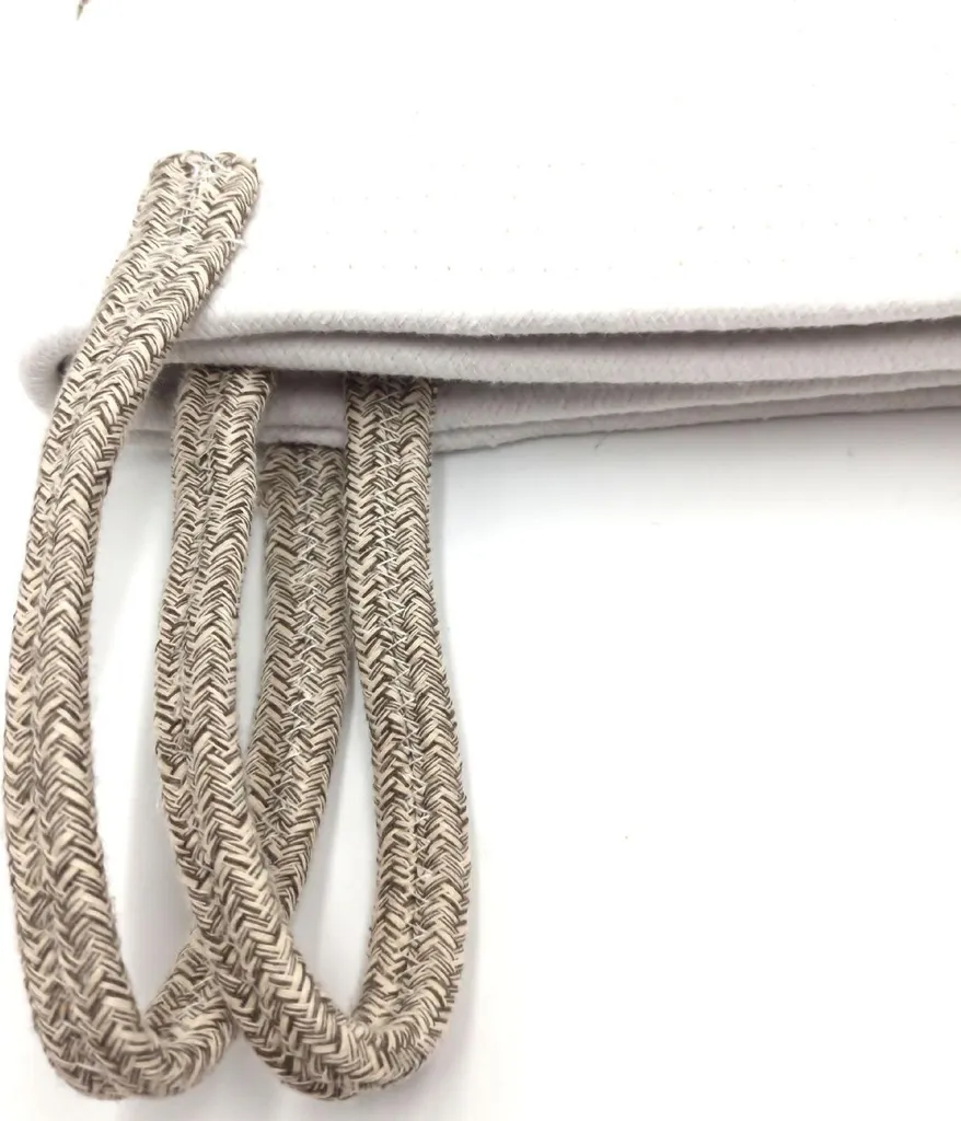 Panier à linge tressé artisanal en coton avec poignées intégrées