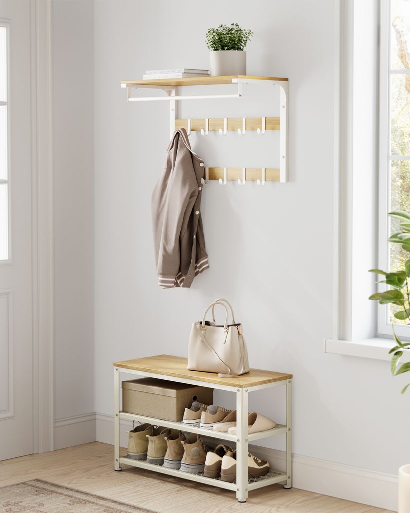 An entryway with a shoe bench and a coat rack.