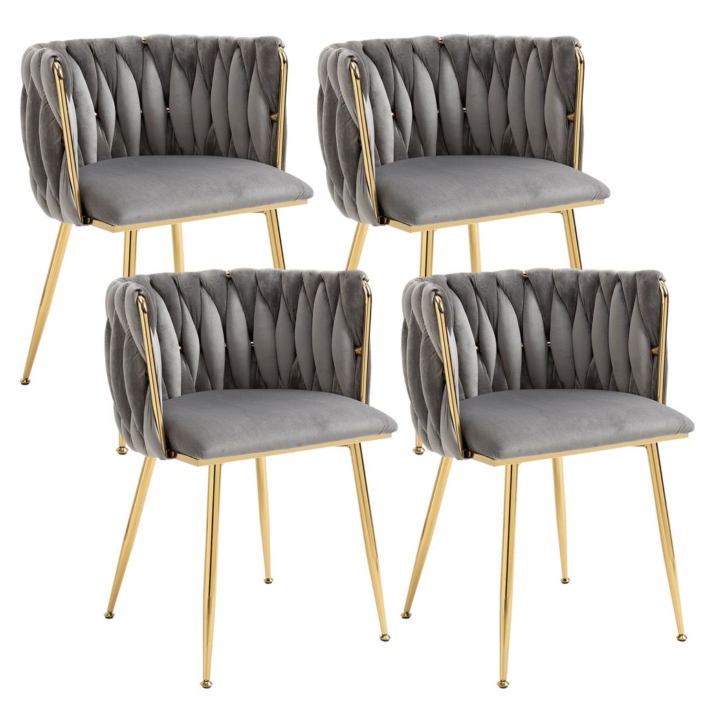 Four gray velvet dining chairs with gold metal frames are arranged in a two-by-two grid against a white background.