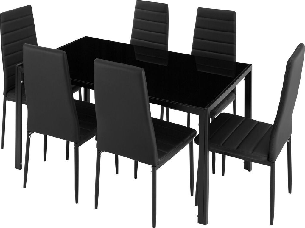 A black glass-top dining table with six black chairs.