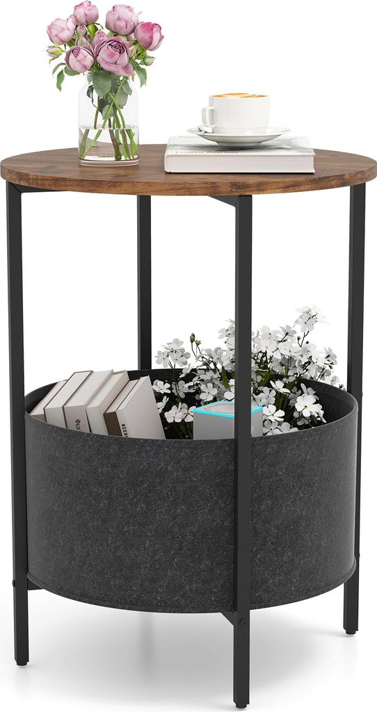 A round side table with a wooden top and a fabric storage basket underneath, decorated with flowers and books.