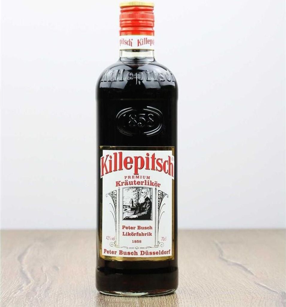 A bottle of Killepitsch liqueur is shown against a plain background.