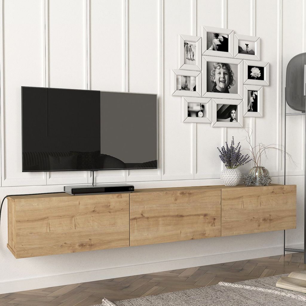 A modern living room setup with a wall-mounted TV and a wooden media console.