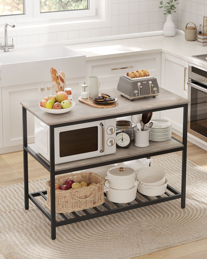 A kitchen island with various kitchen appliances and food items.