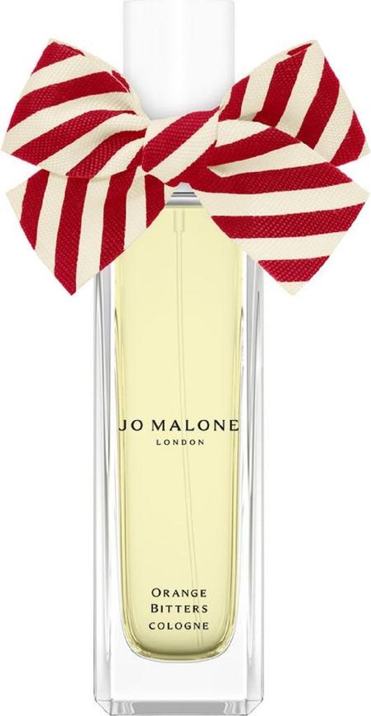 A bottle of Jo Malone Orange Bitters Eau De Cologne with a red and white striped bow on top.