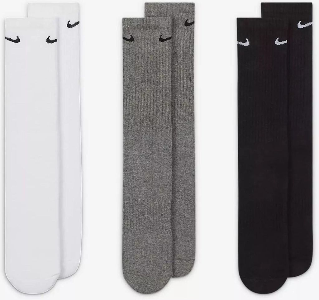 Three pairs of Nike socks in different colors (white, gray, and black) are laid out side-by-side.