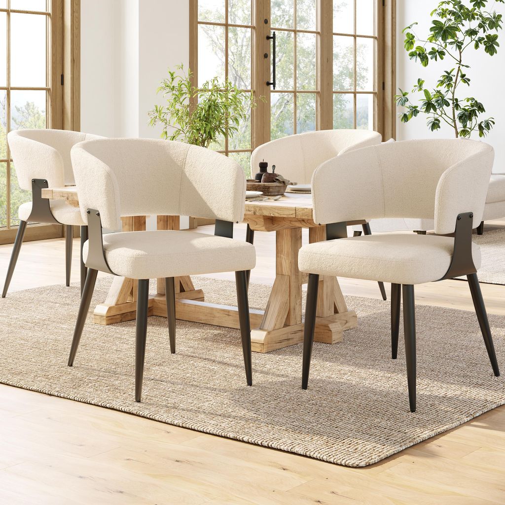 A dining room setting with chairs around a table.