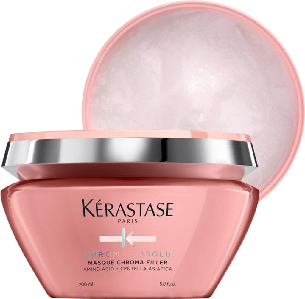 A pink jar of Kerastase hair mask with its lid slightly ajar.