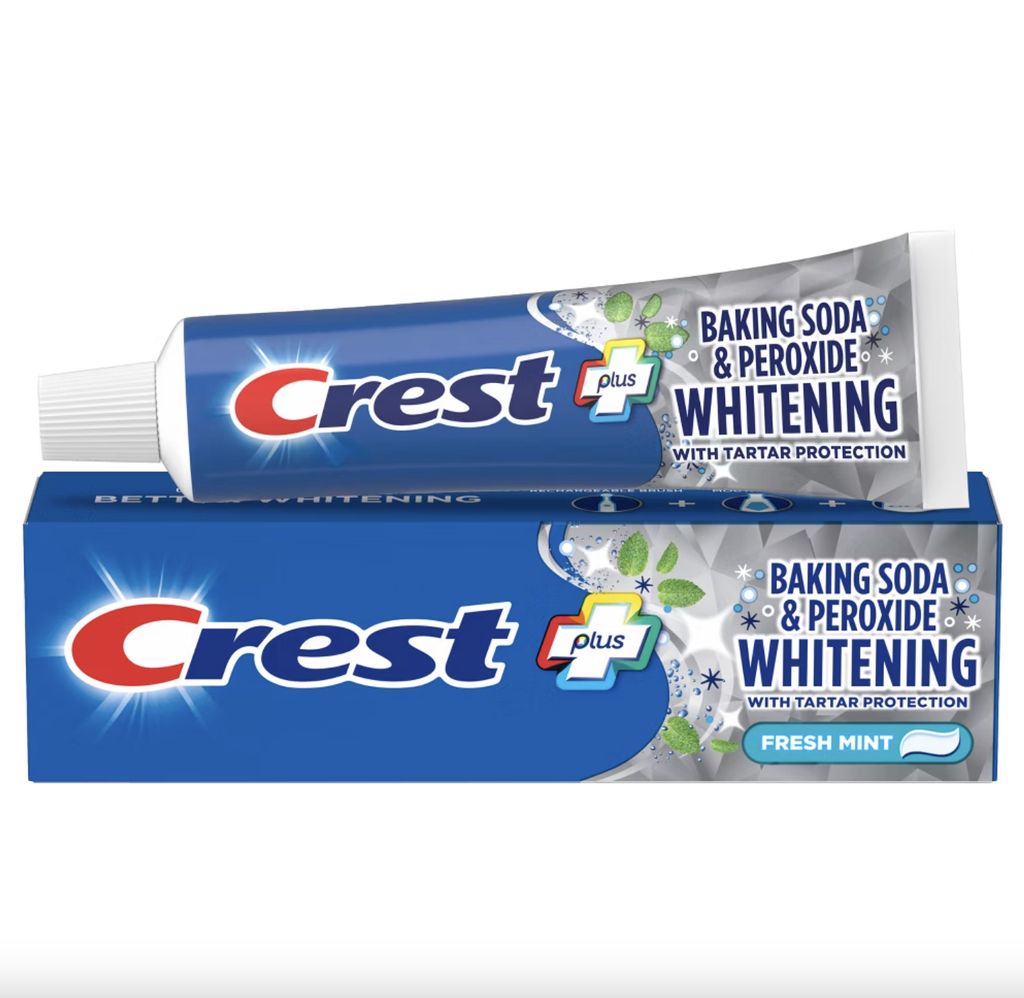 A tube and box of Crest toothpaste.