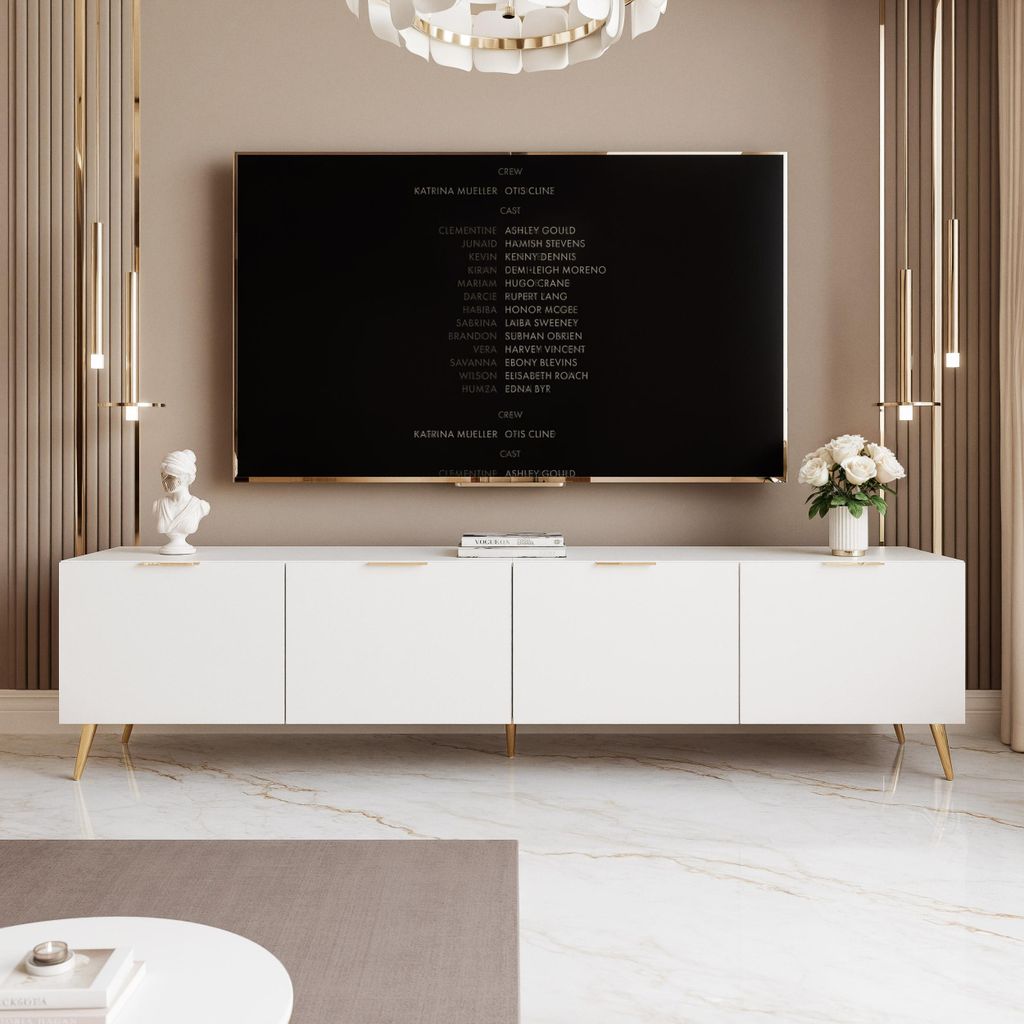 A modern living room with a white TV stand and a large television displaying credits.