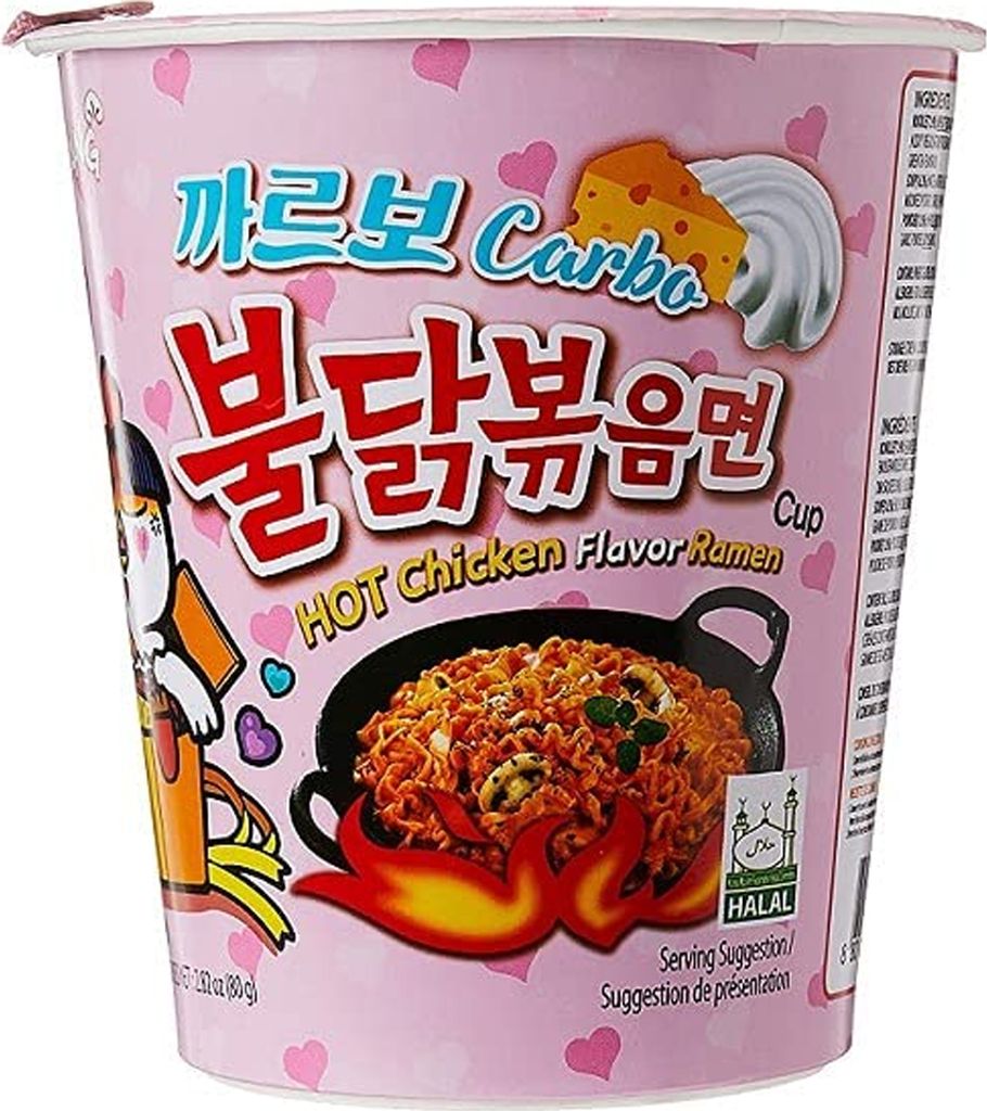 A pink cup of instant ramen with cartoon illustrations and text.
