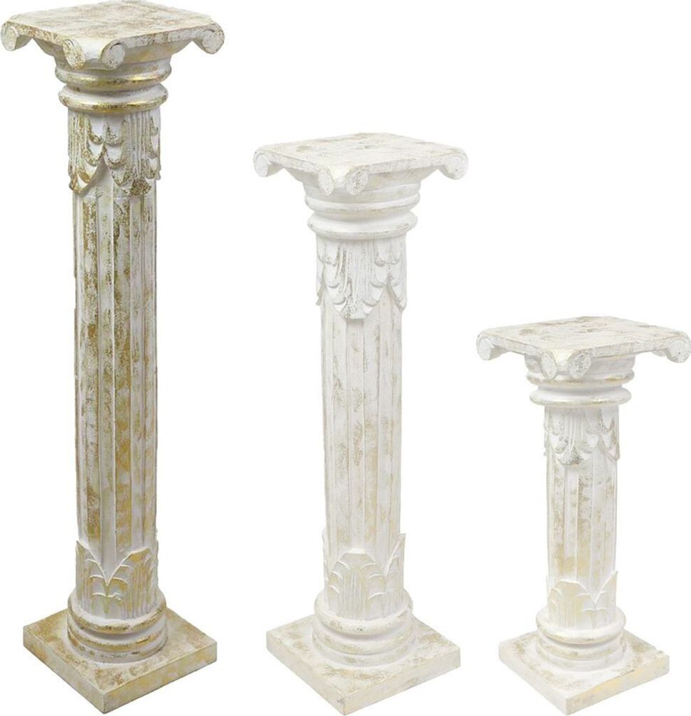 Three decorative classical-style columns of varying heights are arranged against a white background.