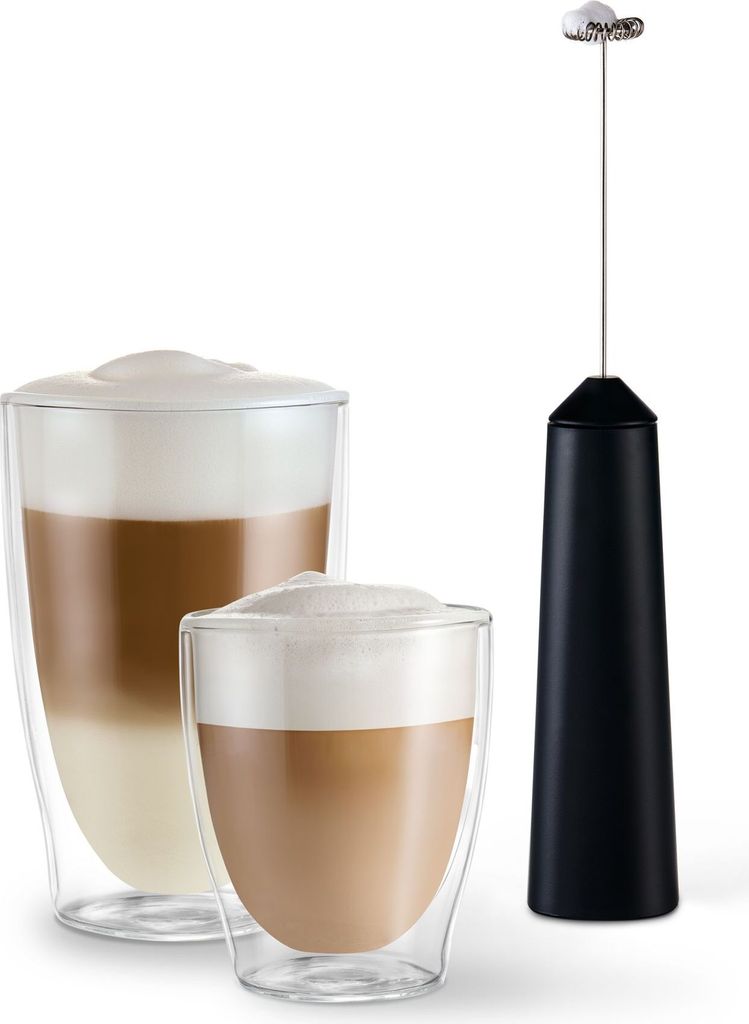 A black milk frother stands next to two glasses of layered coffee drinks.