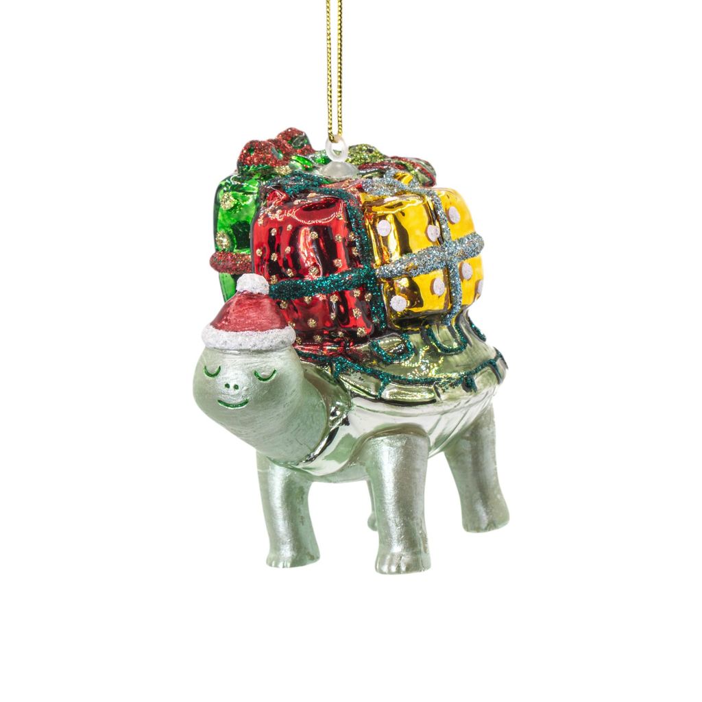 A Christmas ornament shaped like a turtle carrying gifts on its back.