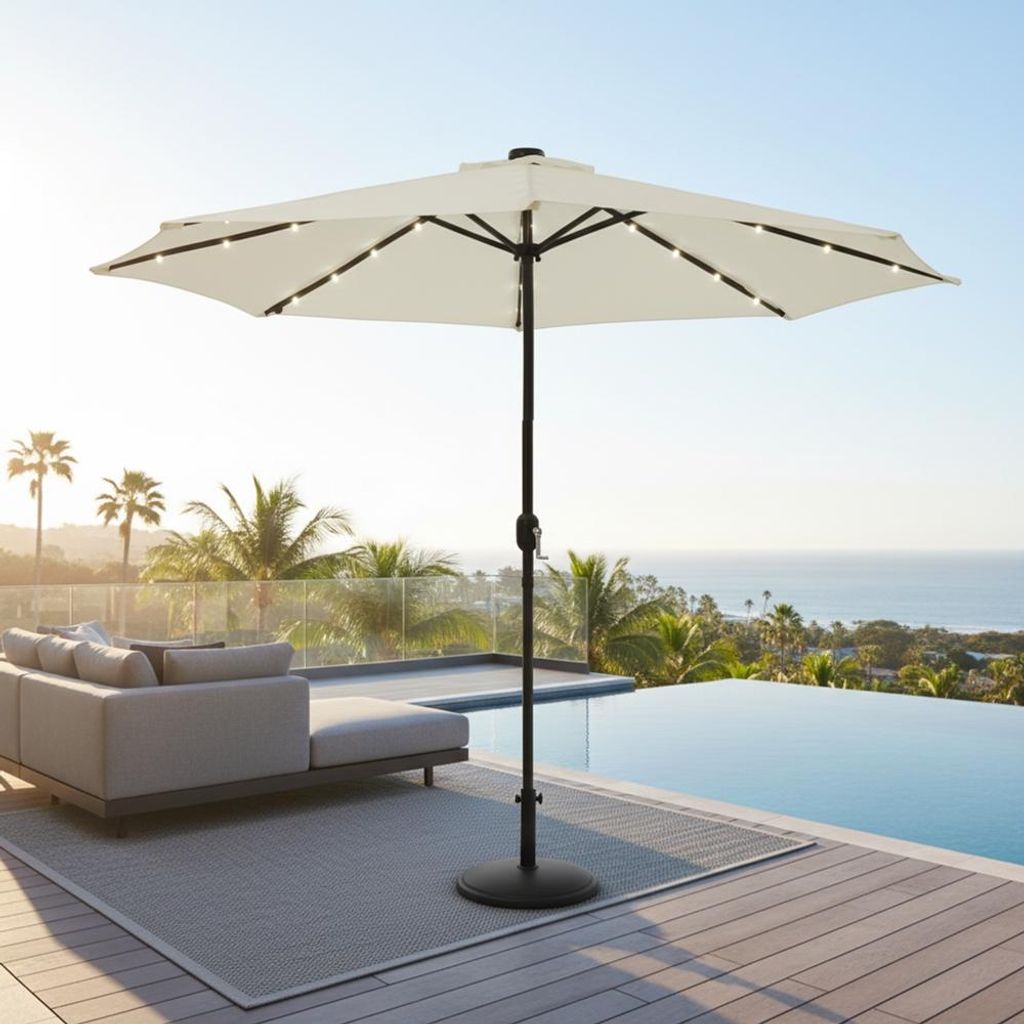 An outdoor patio scene with a pool, lounge furniture, and a beige umbrella with LED lights.