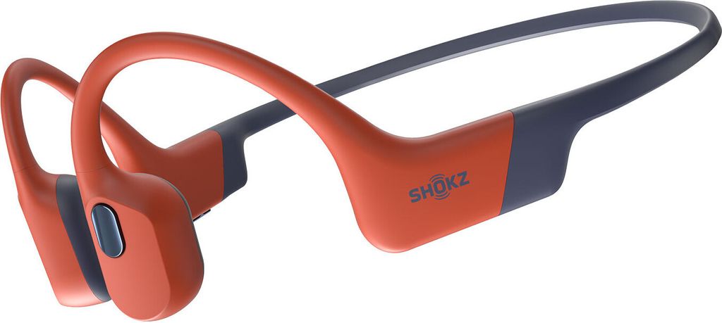 A pair of red and blue Shokz sports headphones against a white background.