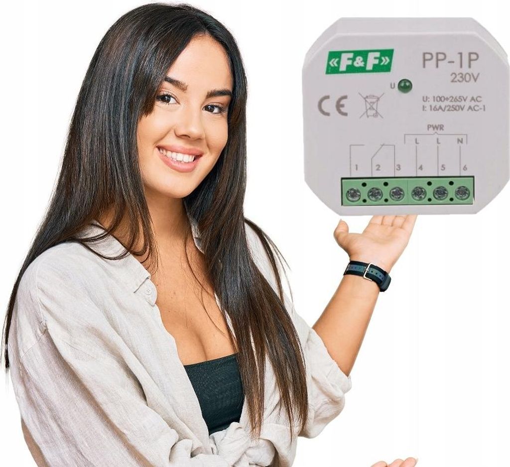 A woman is presenting a small electronic device.