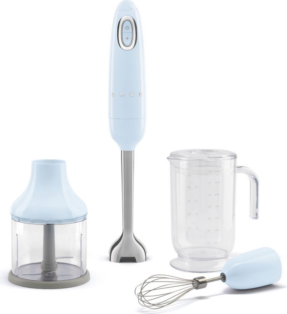 A light blue Smeg hand blender set is displayed against a white background. The set includes the hand blender, a chopper attachment, a beaker, and a whisk attachment.