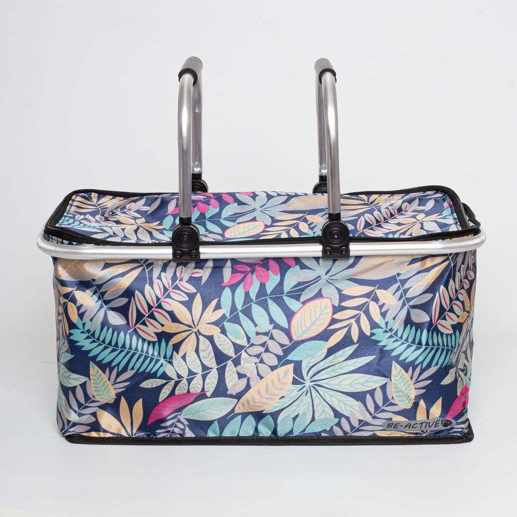 A picnic basket with a floral leaf pattern and silver handles against a white background.