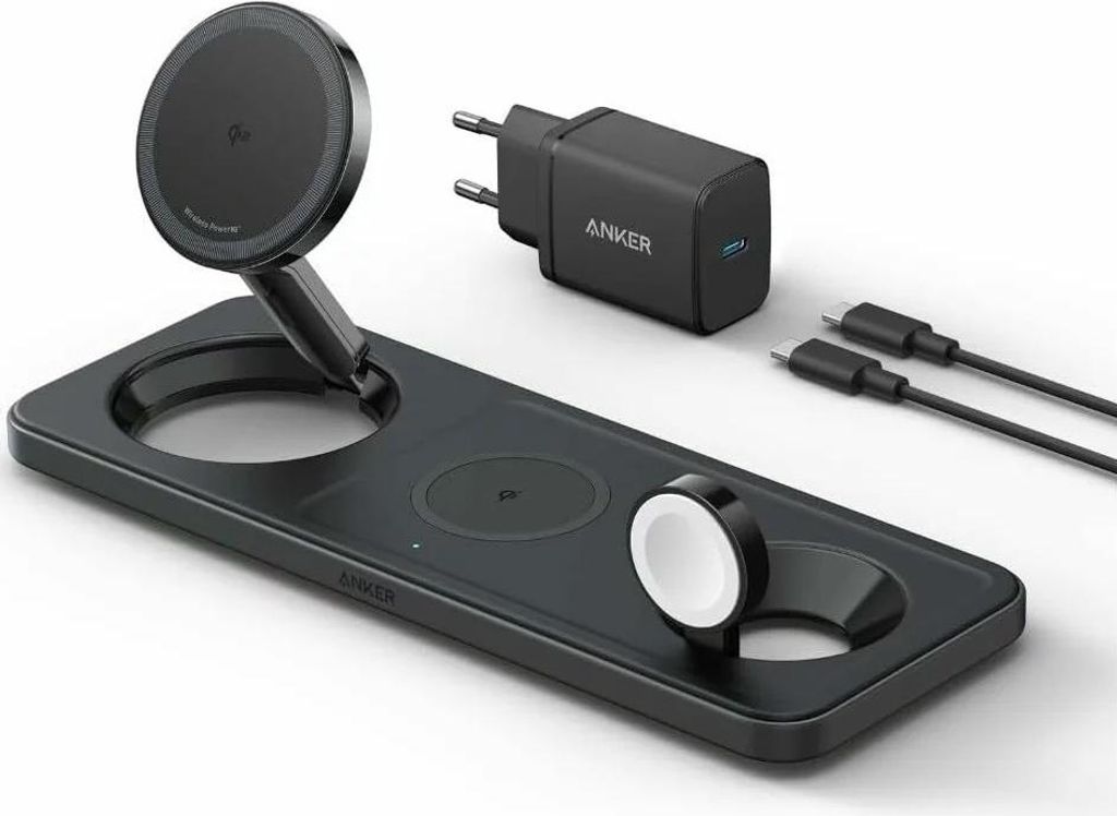 A black wireless charging station with a phone charger, a watch charger, and two USB-C cables, along with a black Anker power adapter.