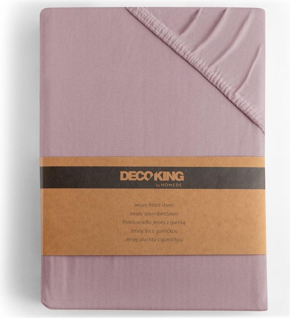 A folded fitted sheet with a product band around it.