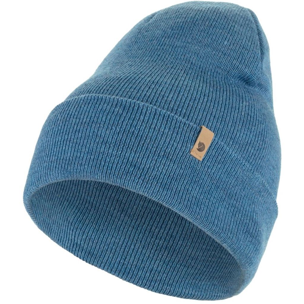A close-up studio shot of a blue knit hat.