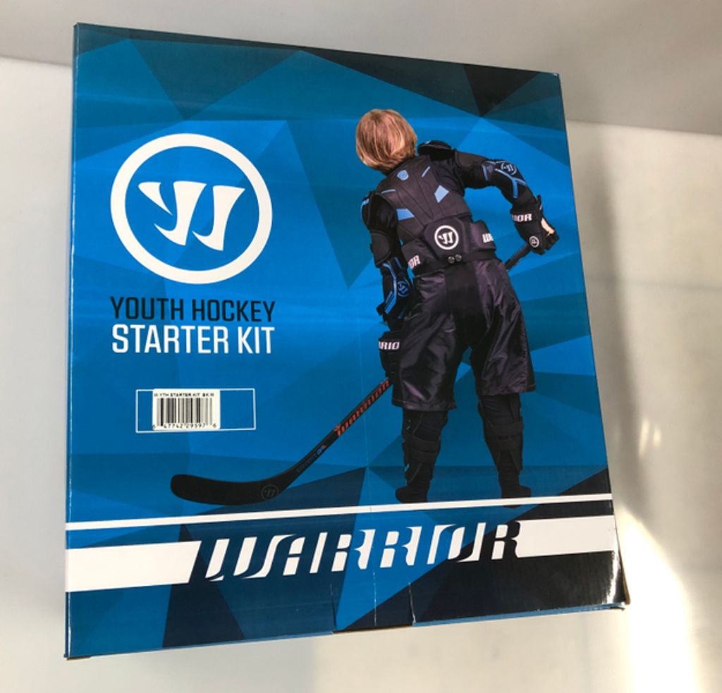 The image shows the front of a Warrior Youth Hockey Starter Kit box, featuring a young hockey player in full gear.