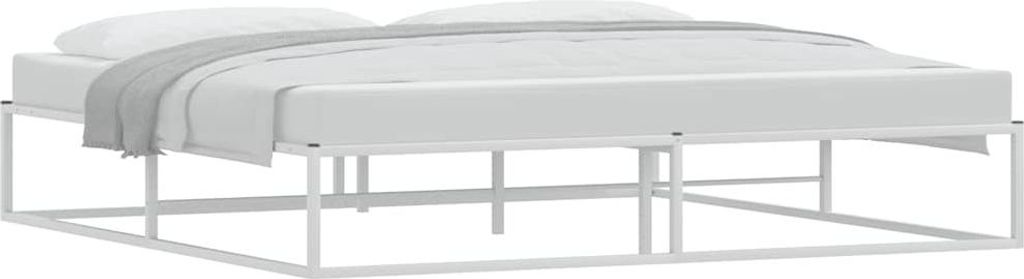 A white metal bed frame with a mattress and a grey blanket.