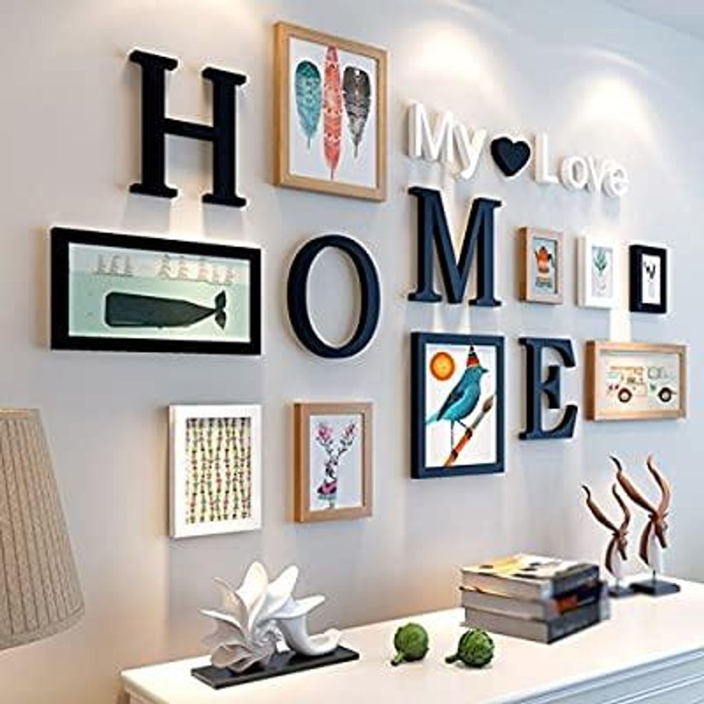 A wall decorated with letters and framed pictures, forming the word 'HOME' and 'My Love'.