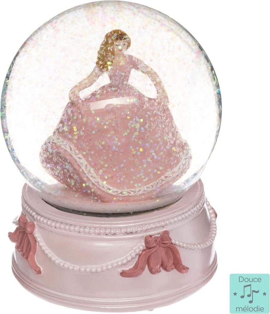 A pink musical snow globe with a princess figurine inside, displayed on a pink base with decorative bows and pearls.