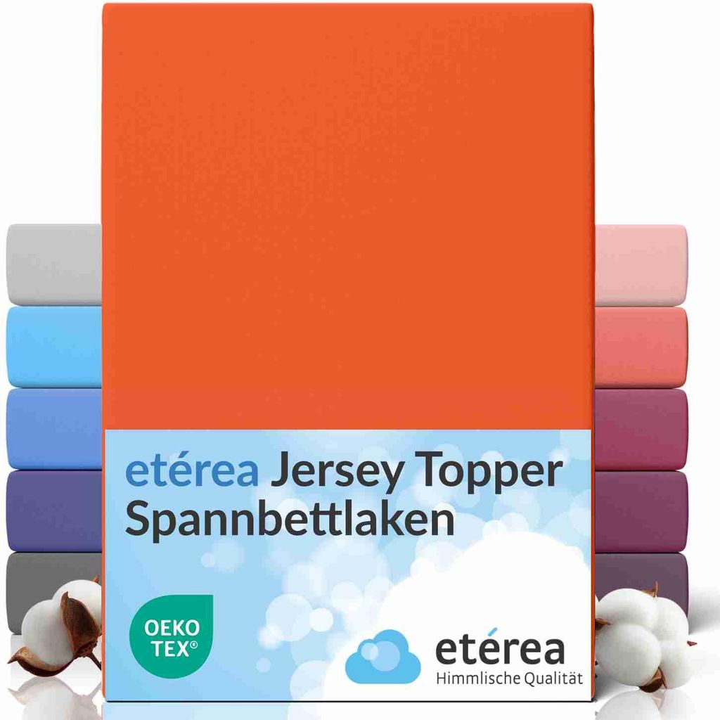 A stack of folded fitted sheets in various colors, with the main product being an orange fitted sheet.